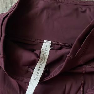 Size 4 Lululemon Maroon colored Leggings.